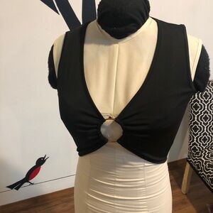 Black M sleeveless fitted top with metal circle center detail. No label.